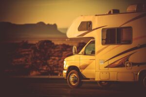 Modern Camper Van Traveling and Camping. Motorcoach in the RV Park Somewhere in the Arizona, United States of America.